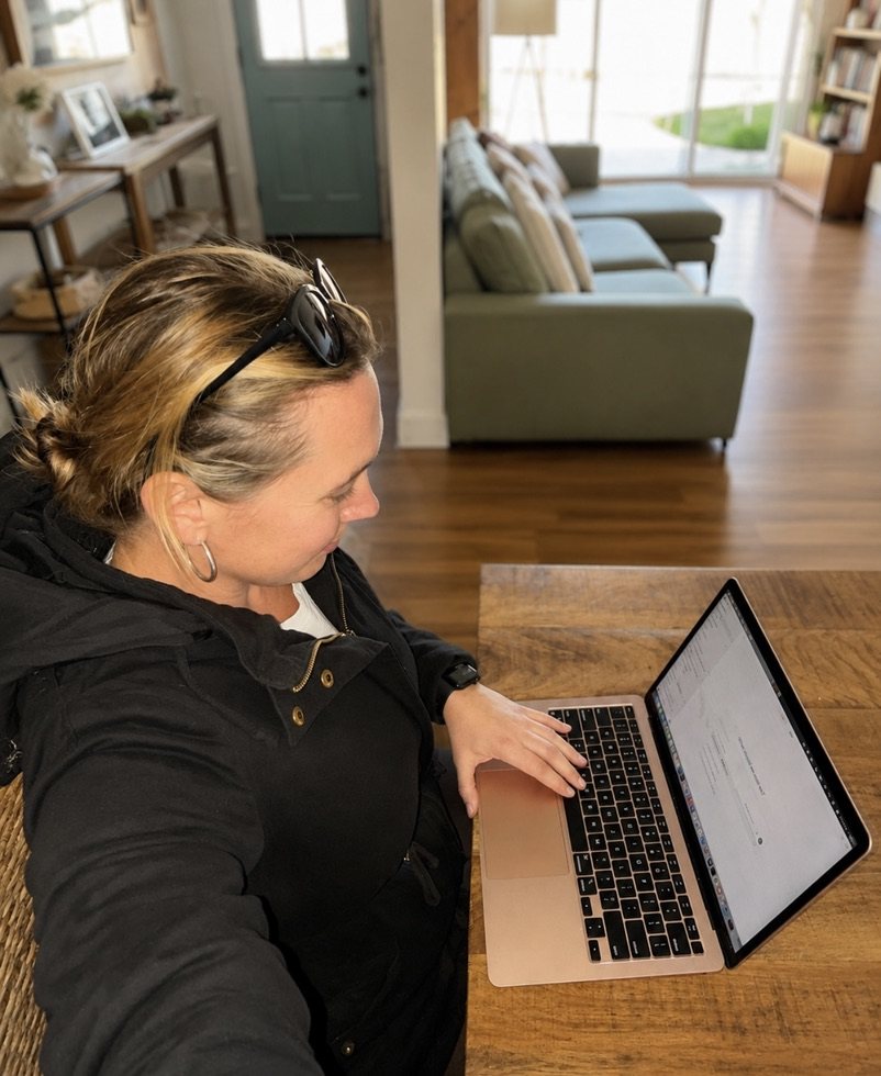 Jessmyn Toovey, founder of Country Smart AI, working at her laptop at home in Mudgee