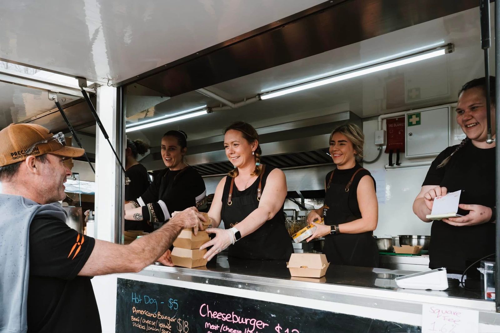 Jessmyn and the Soul Mamas crew serving from the food van window
